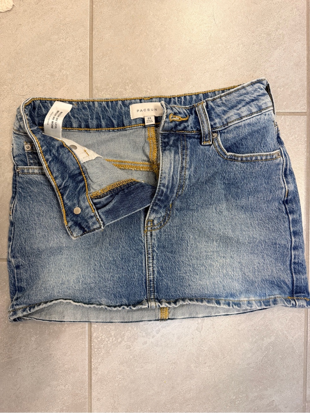 PacSun Bella Denim Mini Skirt in a medium indigo wash.